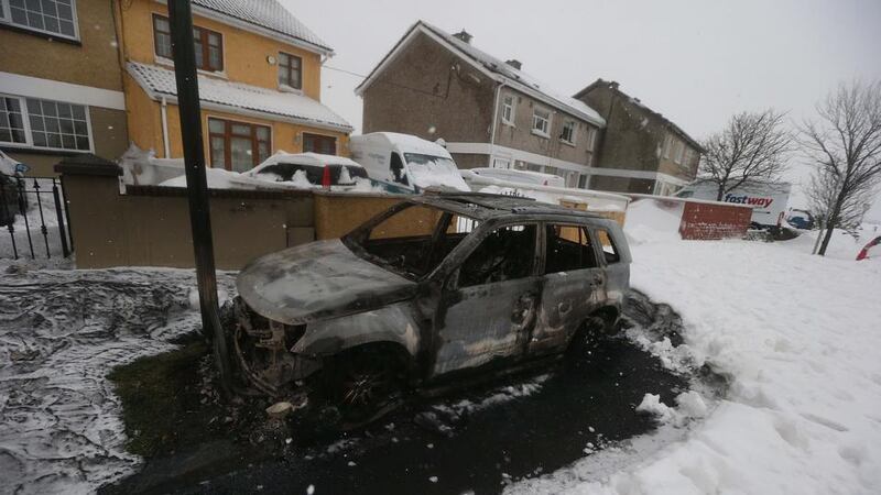 Burnt-out car: at least eight vehicles were set alight after the Lidl looting. Photograph: Stephen Collins/Collins