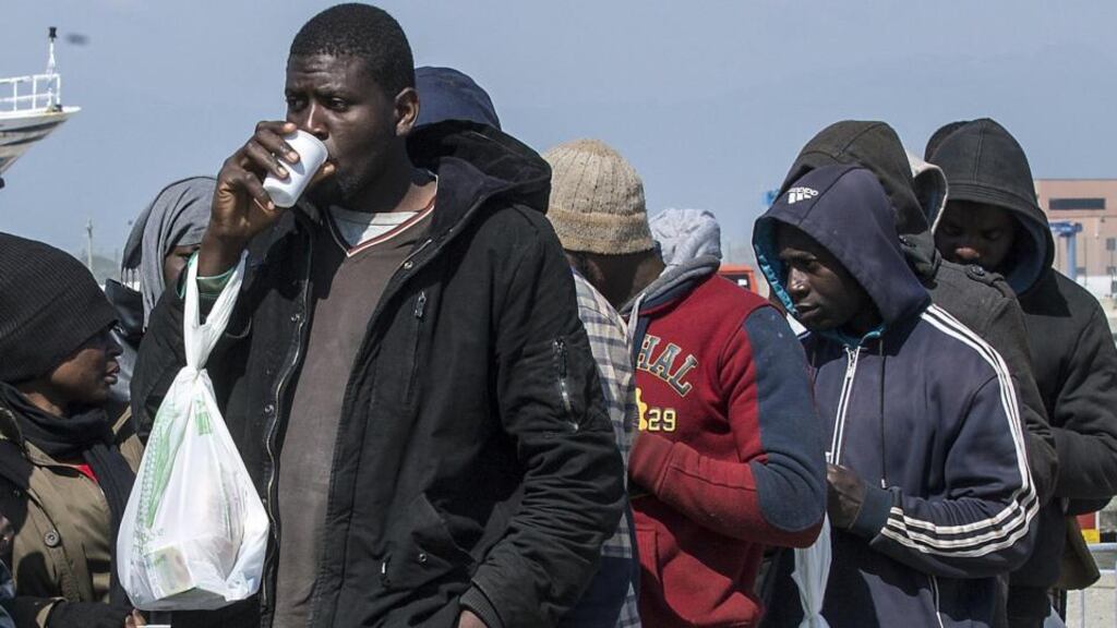 Rescued migrants line up after disembarking at the southern Italian port of Corigliano, Italy, on Wednesday. Photograph: Francesco Arena/ANSA via AP