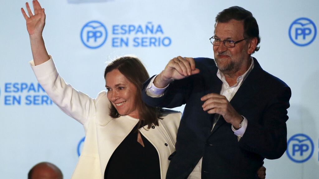 Spain’s Prime Minister and People’s Party (PP) candidate Mariano Rajoy gestures while addressing supporters from a balcony at the party headquarters next to his wife Elvira Fernandez after results were announced in Spain’s general election in Madrid, Spain, on Monday. (Photograph: Marcelo del Pozo/Reuters)