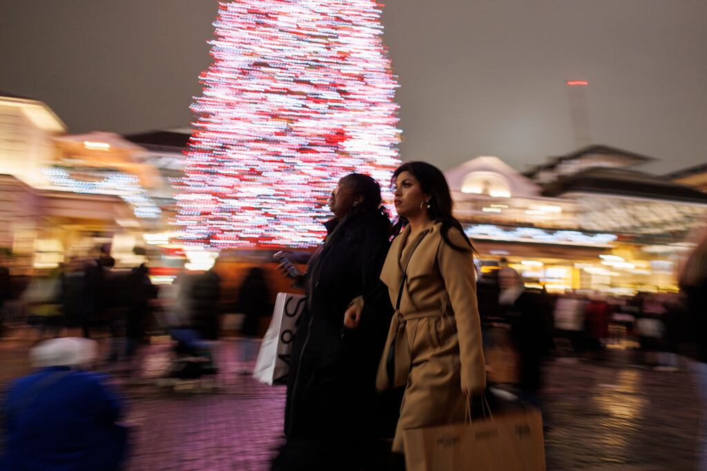 Shoppers in Central London. The UK is at high risk of a serious economic downturn next year, one of the world’s biggest active bond fund managers has warned. Photograph: Tolga Akemn/EPA