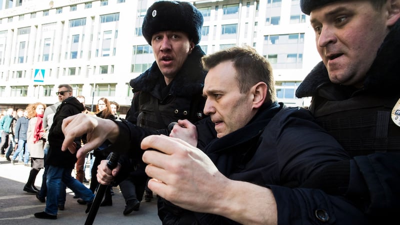 Alexei Navalny is detained by police officers during an opposition rally in central Moscow on March 26th, 2017. Photograph: Evgeny Feldman/Navalny campaign handout/EPA
