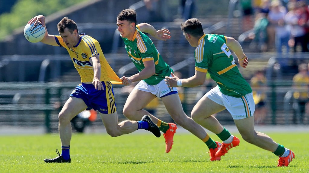 Roscommon’s Conor Devaney with Dean McGovern and James Rooney of Leitrim in the Connacht senior football  semi-final at Dr Hyde Park. Photograph: INPHO/Donall Farmer