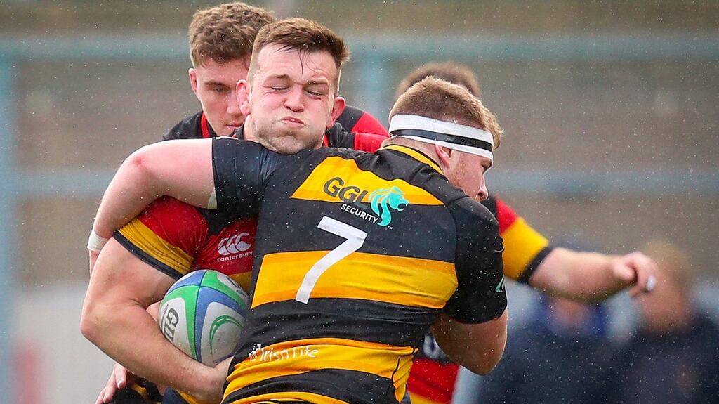 Lansdowne’s David O’Connor is tackled by Young Munster’s Conor Mitchell. Photograph: Oisin Keniry/Inpho