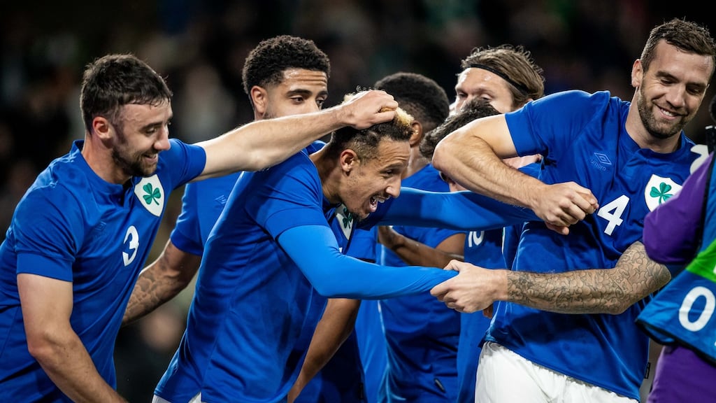 Callum Robinson celebrates scoring his and Ireland’s second goal from the penalty spot with team-mates at the Aviva Stadium. Photograph: Morgan Treacy/Inpho