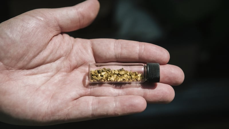 Goldpanner James Linnett shows the gold flakes he found in Scotland at the Victimula Gold Panner’s Arena in the Bessa Natural Reserve in Zubiena, Italy, June 24, 2017. Gianni Cipriano/The New York Times