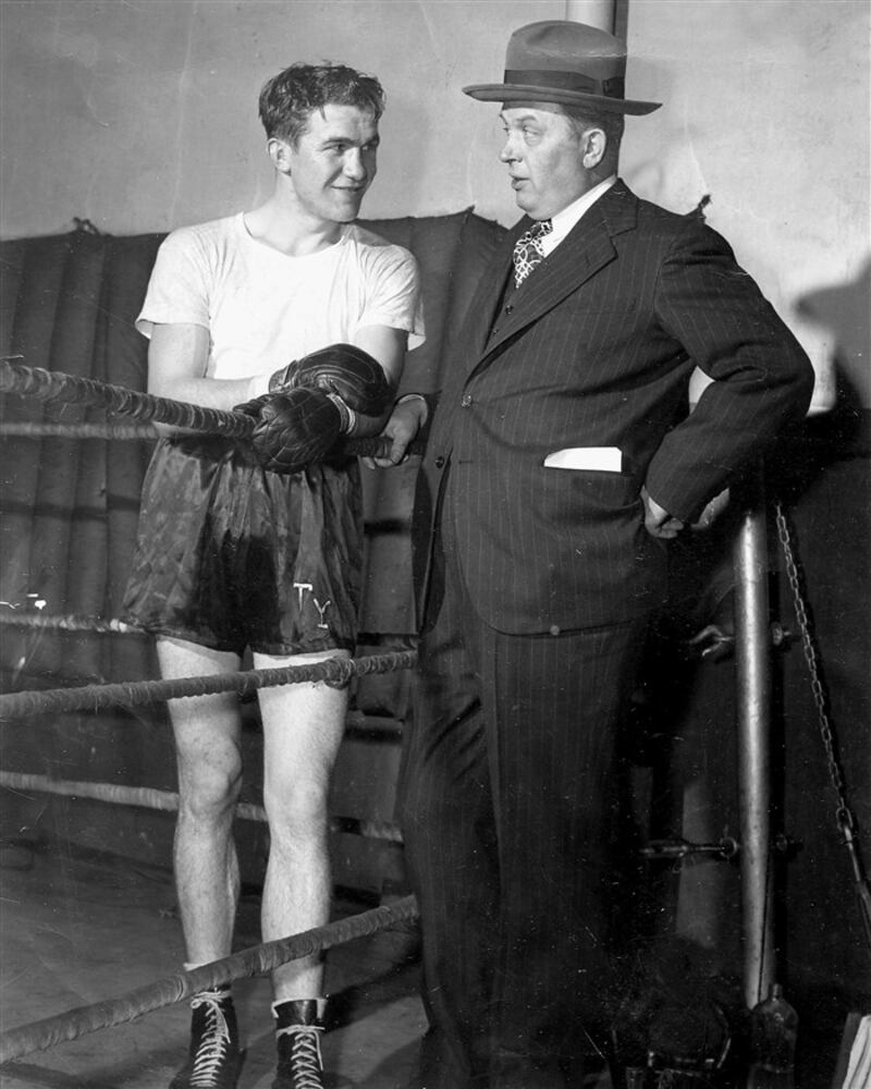 Peter J “Bunny” Buntag with boxer Tommy Yarosz. Even in a gym, Dad had the look of a banker