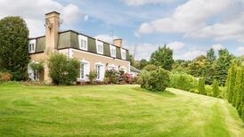 House on 6.5 acres commands open views of  city and sea