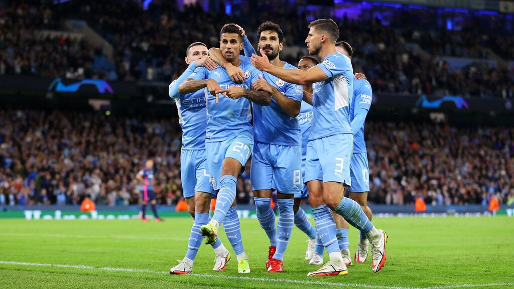 Joao Cancelo is congratulated by his Manchester City team-mates Phil Foden, Ilkay Gündogan and Ruben Dias after scoring their fifth goal during the Champions League Group A match against RB Leipzig at the Etihad Stadium. Photograph: Richard Heathcote/Getty Images