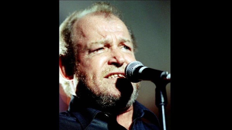 Sweat trickles down the forehead of singer Joe Cocker while he performs at a concert in Zurich in October 1997. Cocker has died aged 70. Photograph: Reuters.