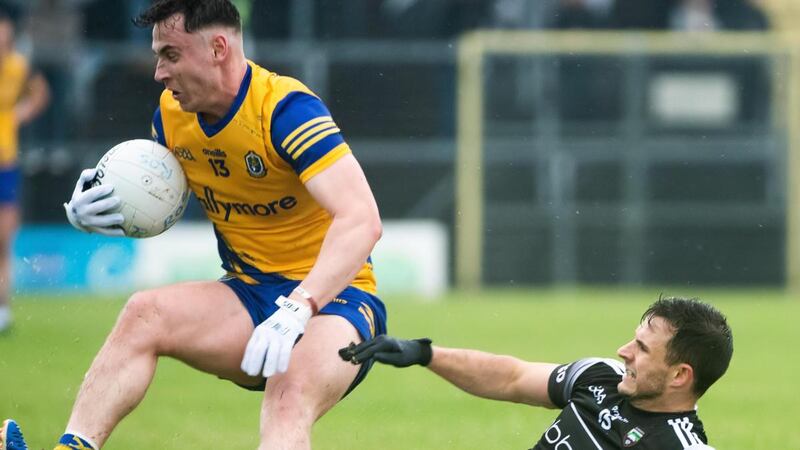Sligo’s Niall Murphy tackles Roscommon’s Cian McKeon during the Connacht SFC semi-final at Markievicz Park. Photograph: Evan Logan/Inpho