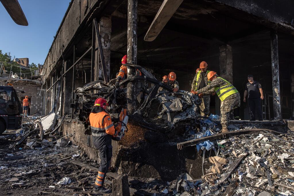 Ukrainian emergency workers and military work at the site of the Russian missile strike in downtown Vinnytsia, Ukraine. Photograph: Roman Pilipey/EPA