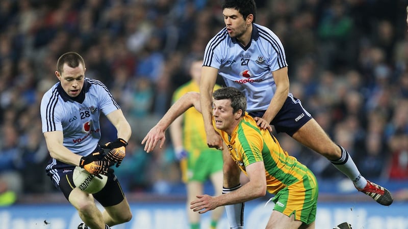 Dean Rock and Cian O’Sullivan tackle Christy Toye of Donegal during an Allianz Football League Division 1A match in March 2012. Photograph: Cathal Noonan/Inpho