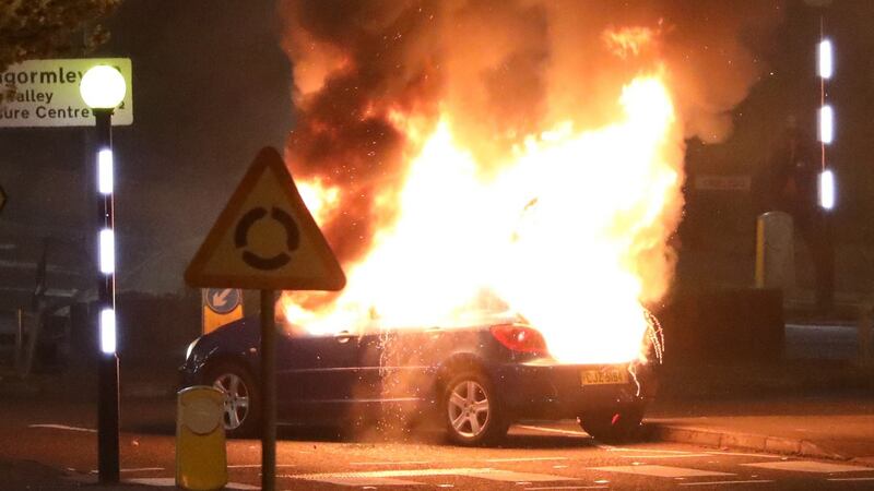 A burning car  at the Cloughfern roundabout in Newtownabbey.  Photograph: Peter Morrison/PA Wire