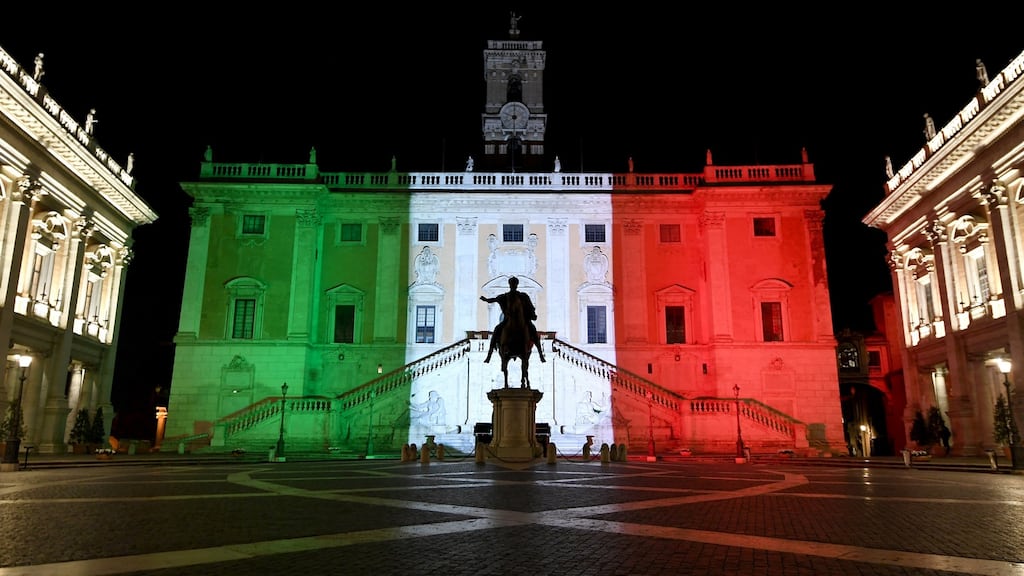 Rome’s Town Hall is lit up with the colours of the Italian flag to show solidarity with the country as it continues to battle coronavirus. Photograph: Reuters/ Alberto Lingria