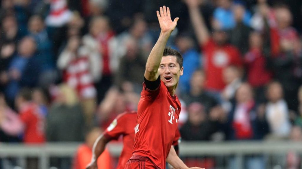 Bayern Munich’s Polish striker Robert Lewandowski celebrates after his fifth goal in the Bundesliga match against VfL Wolfsburg in Munich. Photograph: Christof Stache/AFP