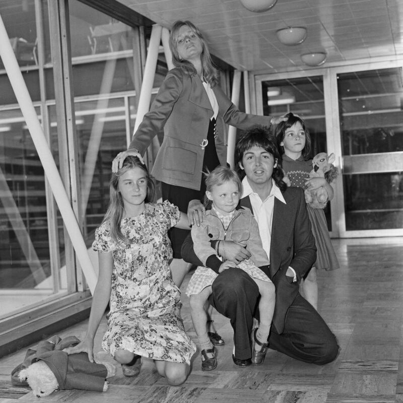 Paul and Linda McCartney at Heathrow Airport with their children Heather, Stella and Mary in 1975. Photograph: Dennis Stone/Mirrorpix via Getty