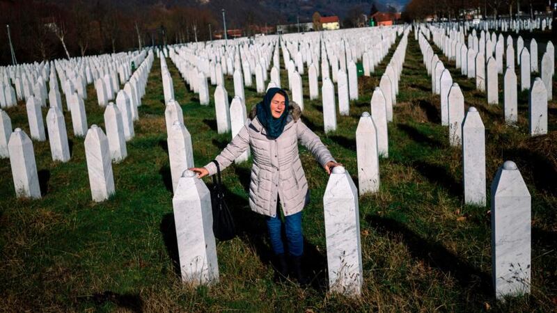 A woman mourns over a relative’s grave at the memorial centre of Potocari near Srebrenica in Bosnia and Herzegovina. Photograph: Dimitar Dilkoff/AFP/Getty Images