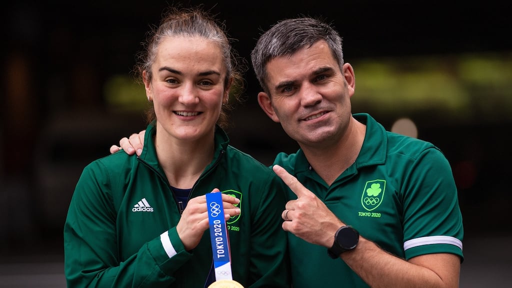 Ireland’s Kellie Harrington and Bernard Dunne celebrate with her gold medal after she beat Beatriz Ferreira in the Tokyo 2020 Olympic final. Photo: James Crombie/Inpho
