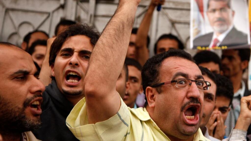 Supporters of deposed Egyptian president Mohamed Mursi shout slogans as they gather for a march to the Egyptian embassy in Sanaa to show solidarity with his supporters in Egypt. Photograph: Khaled Abdullah/Reuters