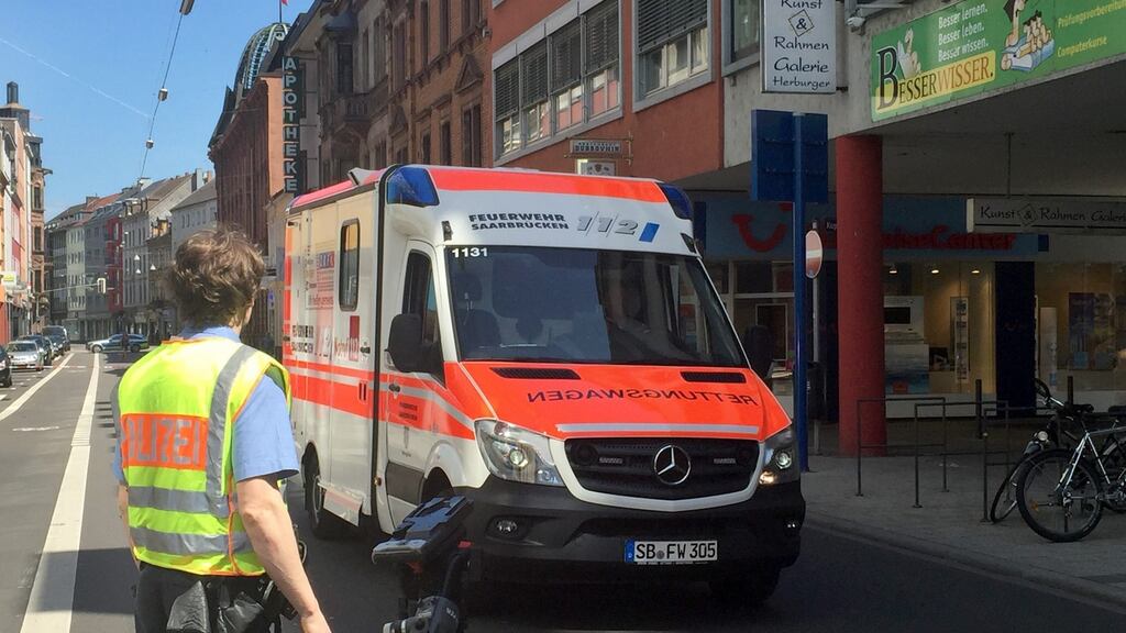 A man is taken away in an ambulance outside the town hall in Saarbruecken, Germany on Sunday. Photograph: Birgit Reichert/EPA
