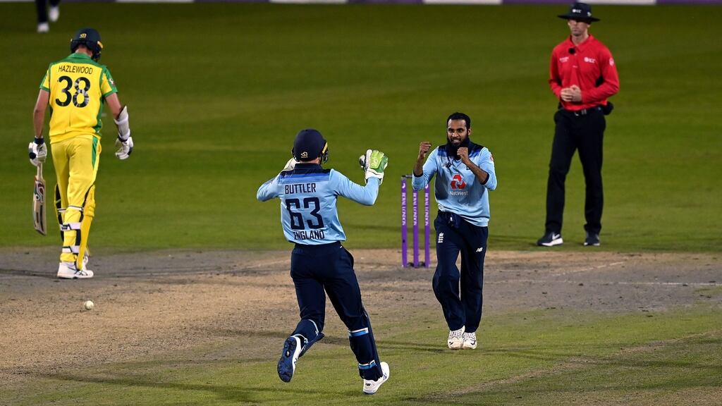 England’s Jos Buttler and Adil Rashid celebrate the game-sealing dismissal of Alex Carey. Photograph: Shaun Botterill/PA
