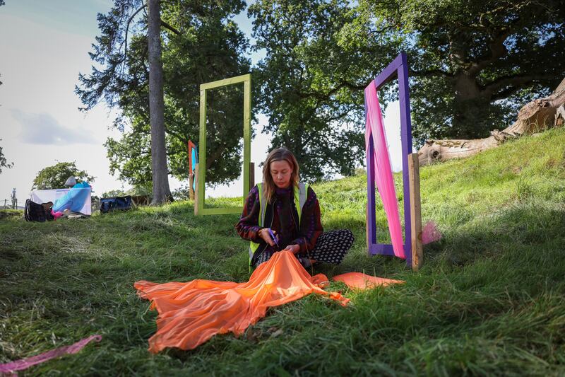 Aimée Trayer from the festival's prop and decorating team at work on the Croí stage. Photograph: Dan Dennison
