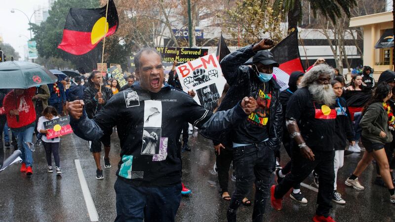 Demonstrators march through the streets during a Black Lives Matter protest to express solidarity with US protesters and demand an end to Aboriginal deaths in custody in Perth, Australia on Saturday. Photograph: Trevor Collens/AFP via Getty