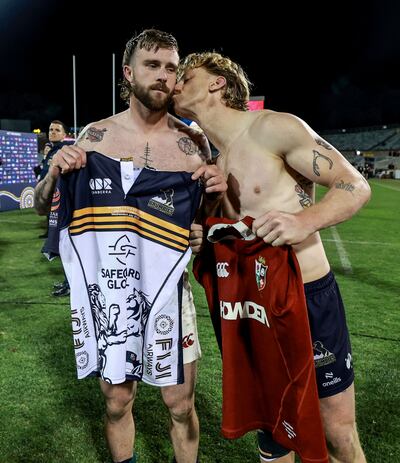Former Connacht team-mates Mack Hansen of the Lions and Ben O’Donnell of the Brumbies swap jerseys after the game. Photograph: Dan Sheridan/Inpho