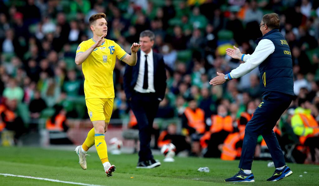 Ukraine’s Viktor Tsygankov celebrates scoring their goal with manager Oleksandr Petrakov during the Nations League game against the Republic of Ireland at the Aviva Stadium. Photograph: Ryan Byrne/Inpho