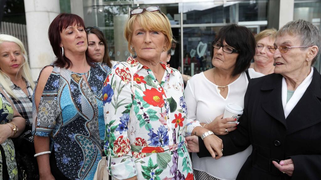 Rose Kenny (centre) with family and friends at the Central Criminal Court yesterday. Denis Leahy pleaded guilty to attempted murder. Photograph: Collins