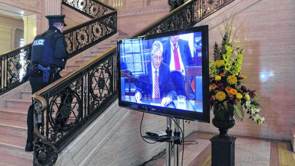 Northern Ireland’s former first minister Peter Robinson is seen on screen testifying before the Nama inquiry at Stormont. Photograph: Pacemaker