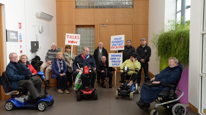 Members of the Justice for Polio Survivors campaign occupying Rehab’s Park West offices in Dublin. Photograph: Dara Mac Dónaill/The Irish Times
