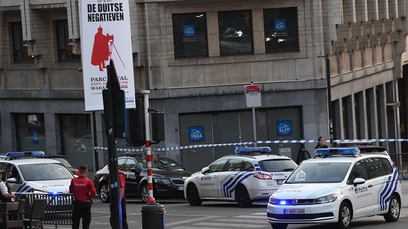 Police vehicles cordon off an area outside Brussels Central Station, after an explosion in the Belgian capital. Photograph: Emmanuel Dunand/AFP/Getty Images