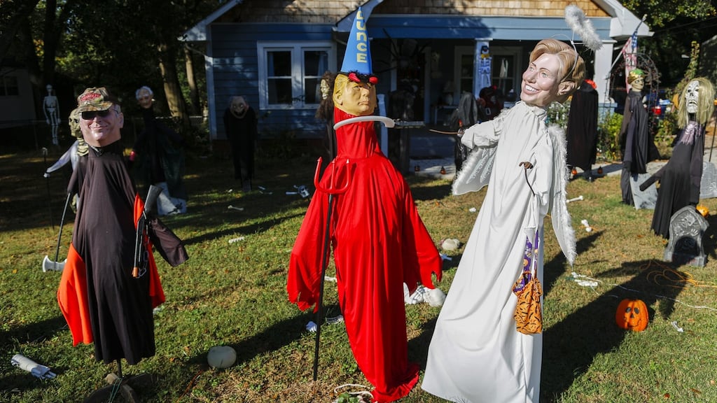 Democratic candidate Hillary Clinton is depicted as an angel, Republican candidate Donald Trump as a devil, with former vice-president Dick Cheney looking on, at a Halloween display in Georgia. Photograph: Erik S Lesser/EPA