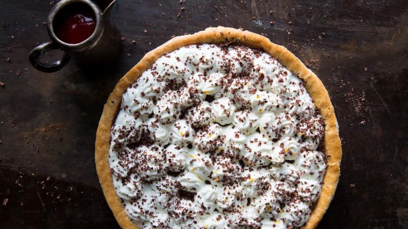 Rich chocolate orange tart with raspberry sauce
