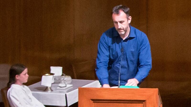 Philip Grant, Consul General Of Ireland for the Western US,  delivers a reading at the Month’s Mind Commemoration Mass for the Berkeley tragedy victims. Photograph: Martin Lacey.