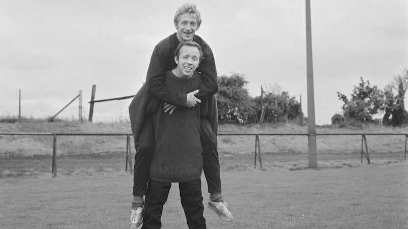 Nobby Stiles with Denis Law on his back during a United training session in 1968. Photo: Evening Standard/Hulton Archive/Getty Images
