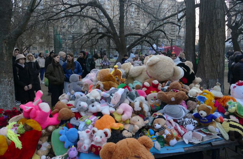 Ukrainians bring toys flowers and candles to the site of a Russian drone attack in Odesa, Ukraine, on Saturday. Twelve people, including five children, were killed. Photograph: Igor Tkachenko/EPA