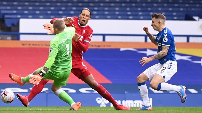 Jordan Pickford challenges Virgil van Dijk during Everton’s draw with Liverpool. Photograph: Peter Byrne/EPA