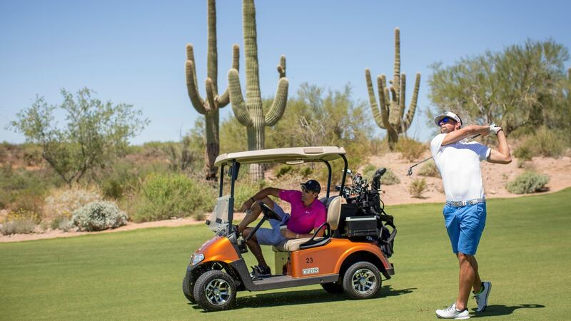 Grant Hackett, left, and Michael Phelps playing golf  at the Scottsdale National Golf Club in Arizona.  The two men are close friends, brought together not just by their sport, but also their similar struggles dealing with fame and personal demons. Photograph: Caitlin O’Hara/The New York Times)