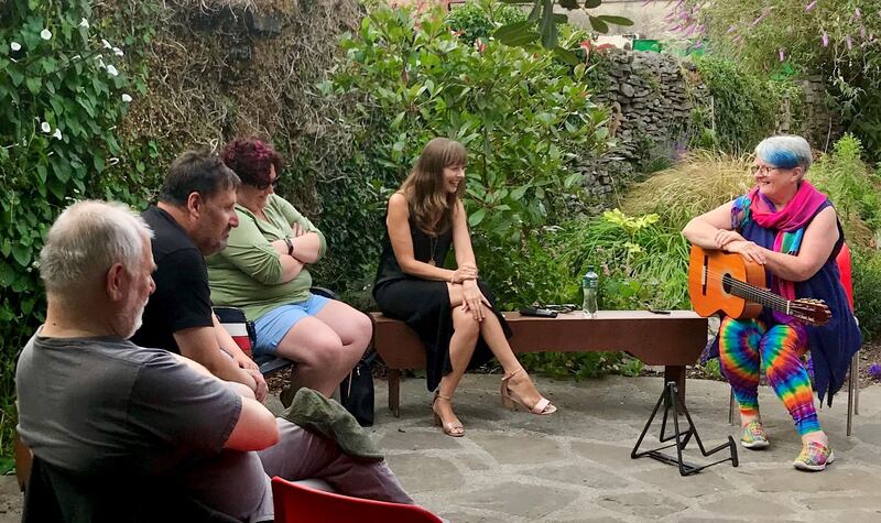 Anne Casey (centre) reads poetry with Anne Rynne of Three Women Sing in Miltown Malbay, in Co Clare