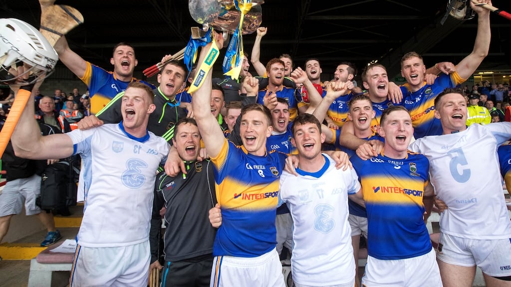 Tipperary celebrate with the trophy after beating Waterford at the Gaelic Grounds. Photograph: Ryan Byrne/Inpho
