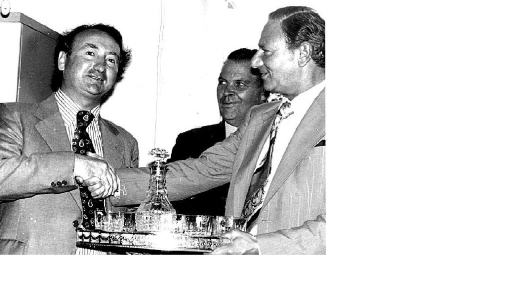 Justice Hubert Wine making a presentation to Christopher Hogarty (left) on the occasion of his promotion to registrar of the High Court in 1978.