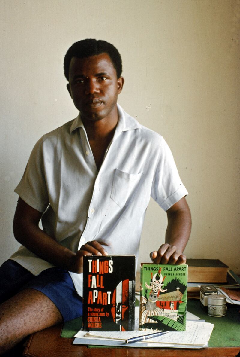 Nigerian author Chinua Achebe holding two editions of his book Things Fall Apart. Photograph: Eliot Elisofon/The LIFE Picture Collection via Getty Images
