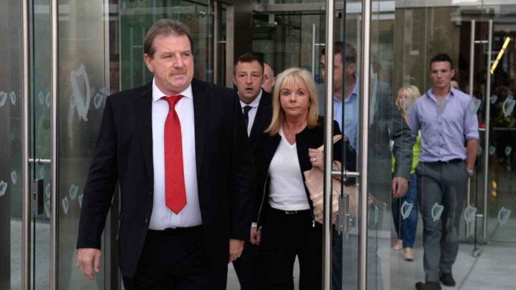 Steve Collins, his wife Carmel and family leave the Special Criminal Court in Dublin. Photograph; Dara Mac Dónaill
