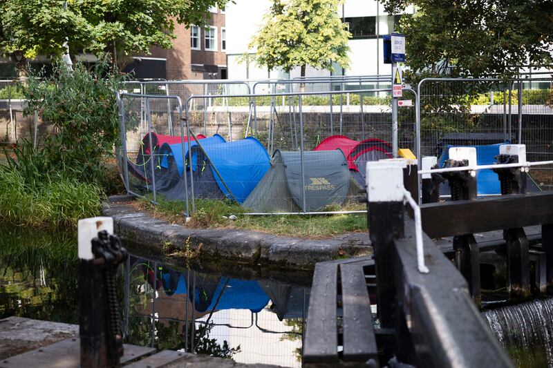 Tents pitched within the barriers at the Grand Canal in Dublin. Photograph: Sam Boal/Collins