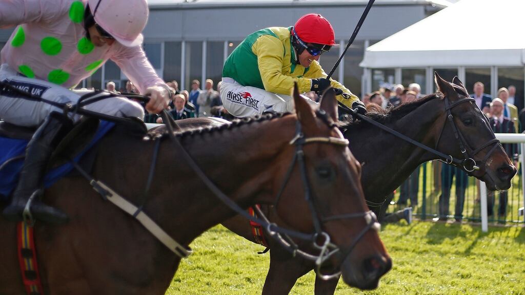 Robbie Power riding Sizing John (right) wins the  The Coral Punchestown Gold Cup from Djakadam  at Punchestown.  Photograph: Alan Crowhurst/Getty Images