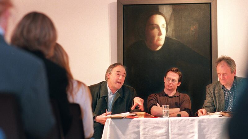 Redmond O’ Hanlon, left, speaks at the Kate O’Brien Weekend in 1999 with James Heaney and Derek Cahill in the Hunt Museum, in Limerick, before a portrait of Kate O’Brien. Photograph: Dara Mac Dónaill