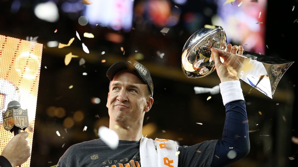 Denver Broncos quarterback Peyton Manning holds the Super Bowl trophy after his team beat the Carolina Panthers. Photo: Patrick Smith/Getty Images