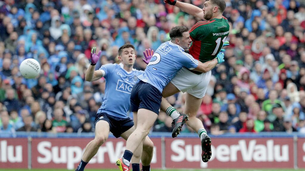 Dublin’s Philip McMahon grapples with Mayo’s Aidan O’Shea in the drawn All-Ireland final. Photograph: Morgan Treacy/Inpho